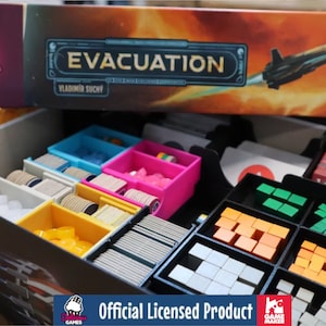 May include: A board game box labeled "EVACUATION" with a spaceship illustration. Inside, colorful plastic organizers hold game pieces of various shapes and colors, including white, yellow, pink, and green. The box is an official licensed product.