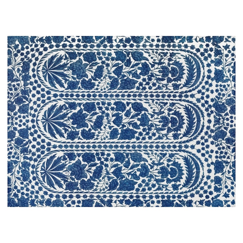 May include: A rectangular textile with a repeating floral pattern in shades of blue on a white background. The design features three elongated oval panels filled with flowers and leaves, framed by decorative borders. The overall aesthetic is reminiscent of traditional block printing.