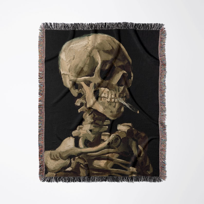 a blanket with a skeleton smoking a cigarette