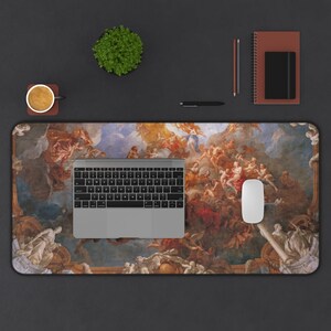 May include: A large desk mat featuring a colorful painting of a ceiling fresco with figures and clouds. The mat is designed to protect a desk surface from scratches and wear.