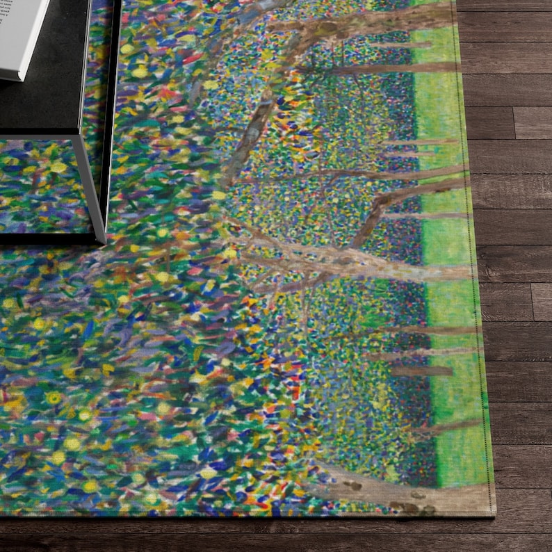 May include: A colorful abstract rug with a green, blue, and yellow pattern. The rug features a design of trees and leaves.