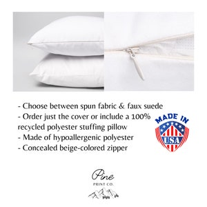 May include: Two white pillowcases with a beige zipper. The pillowcases are made of spun fabric or faux suede. The text "MADE IN USA" is on a red, white, and blue star-shaped label. The text "Pine PRINT CO." is below a stylized mountain range.