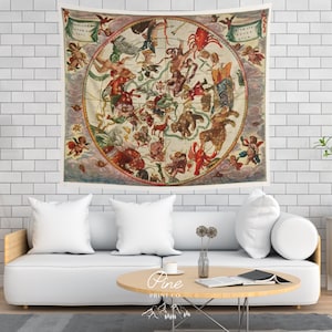 May include: A vintage tapestry featuring a detailed illustration of the constellations. The tapestry is circular and has a cream background with a variety of colors, including red, blue, green, and gold. The constellations are depicted with intricate details and are surrounded by clouds and cherubs.