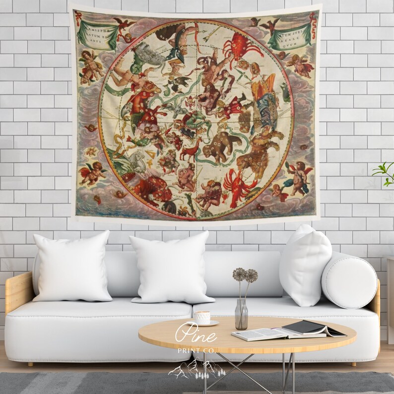 May include: A vintage tapestry featuring a detailed illustration of the constellations. The tapestry is circular and has a cream background with a variety of colors, including red, blue, green, and gold. The constellations are depicted with intricate details and are surrounded by clouds and cherubs.