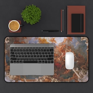 May include: A desk mat with a colorful painting of a ceiling fresco. The painting features angels and clouds. A laptop, a mouse, and a coffee cup are on the desk mat.