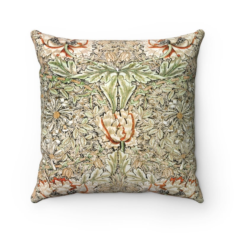 May include: A square throw pillow with a floral pattern in shades of green, brown, and white. The pattern features stylized flowers and leaves.
