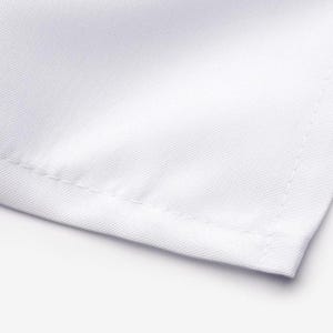 A close-up view of a white fabric, possibly a sheet or a towel, with a slight crease visible at the edge.