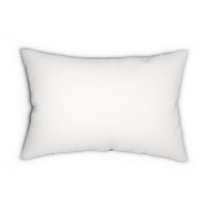 May include: A white rectangular pillow with a soft, fluffy texture.