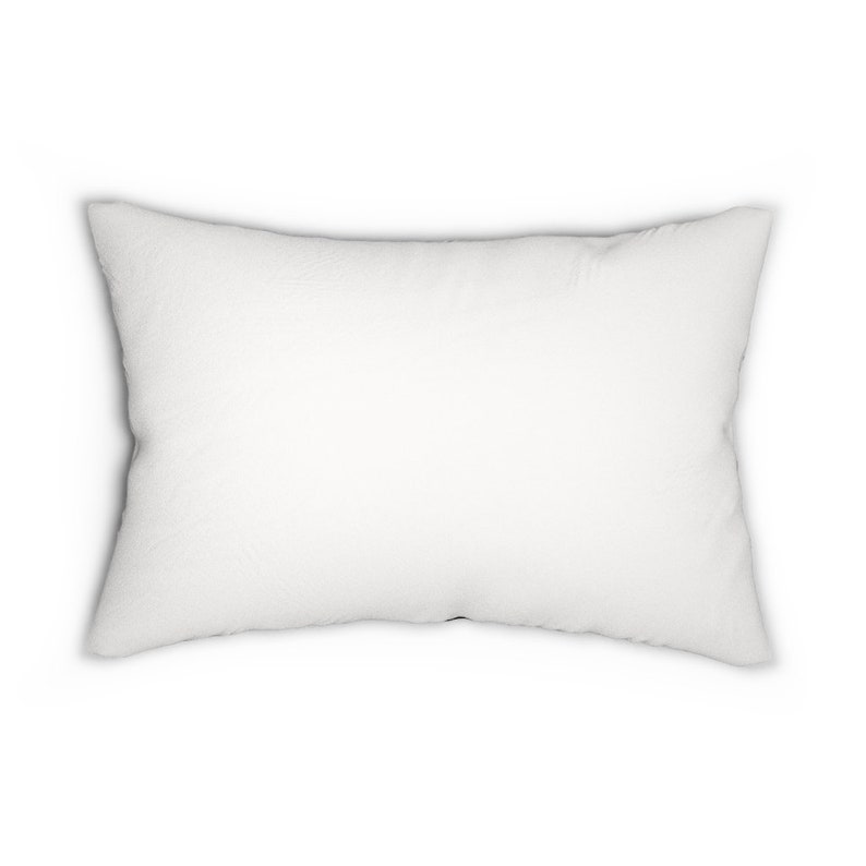 May include: A white rectangular pillow with a soft, fluffy texture.