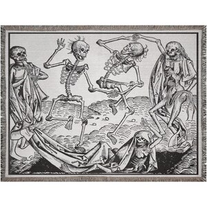 May include: A woven throw blanket featuring a black and white illustration of dancing skeletons. The design includes figures playing instruments and draped in fabric, with a fringed border. The artwork has a vintage, gothic aesthetic.