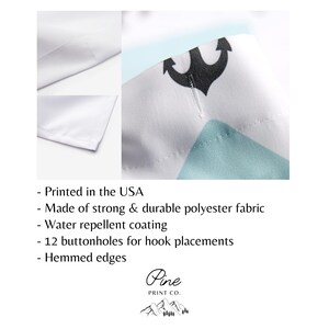 May include: White shower curtain with a blue and green geometric pattern and a black anchor. The shower curtain has 12 buttonholes for hooks and hemmed edges. It is made of strong and durable polyester fabric and is water repellent. Printed in the USA.