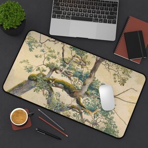May include: A mouse pad featuring a watercolor painting of a tree with green leaves and branches against a light beige background.