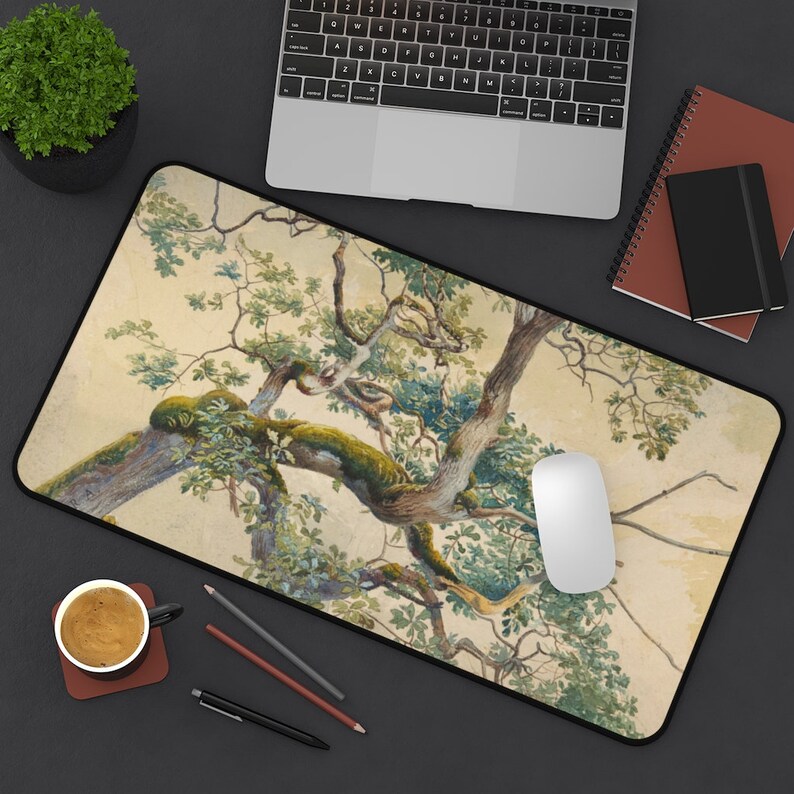 May include: A mouse pad featuring a watercolor painting of a tree with green leaves and branches against a light beige background.