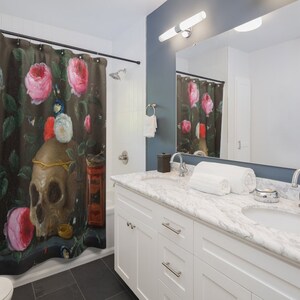May include: A shower curtain featuring a still life painting of a skull, roses, and other objects on a dark background. The skull is surrounded by pink roses and other flowers. The painting is in a vintage style.