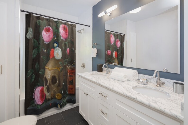 May include: A shower curtain featuring a still life painting of a skull, roses, and other objects on a dark background. The skull is surrounded by pink roses and other flowers. The painting is in a vintage style.