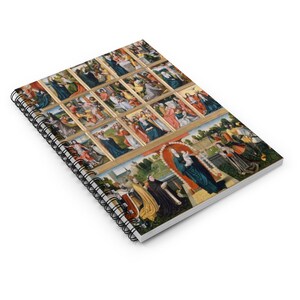 May include: A spiral bound notebook with a colorful image of a religious scene. The image is made up of many small squares, each depicting a different scene. The main image shows a woman in blue robes holding a baby.