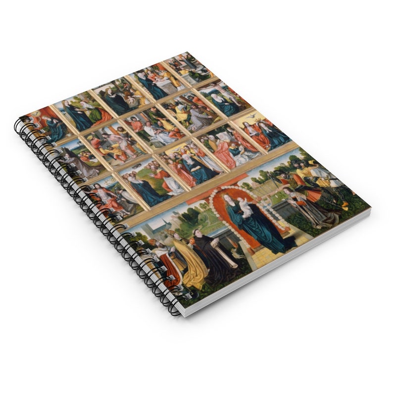 May include: A spiral bound notebook with a colorful image of a religious scene. The image is made up of many small squares, each depicting a different scene. The main image shows a woman in blue robes holding a baby.