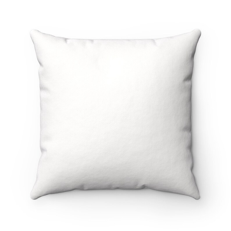 May include: A white square pillow with a smooth, soft fabric surface.
