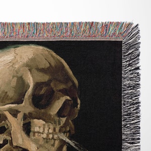 a painting of a skull with a cigarette in its mouth