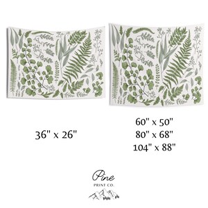 May include: A white tapestry with a green botanical print featuring various leaves and ferns. The tapestry is available in three sizes: 36 inches by 26 inches, 60 inches by 50 inches, and 80 inches by 68 inches.