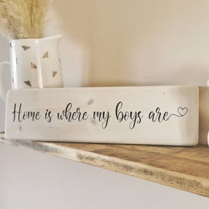 Home is where my boys are, Home is where my girls are, Home is where my dogs are. Wooden sign