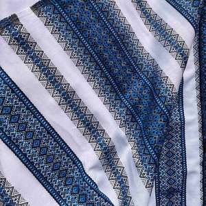 Ethnic Fabric. Woven Fabric. Ukrainian Vyshyvanka Fabric. Decorative Clothes blue Emboidery.Tablecloth on the table. Ukrainian home decor