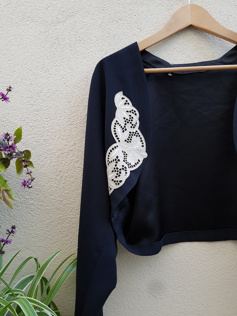 Black and white vintage jacket with guipure lace jacket style and open vest cut spencer