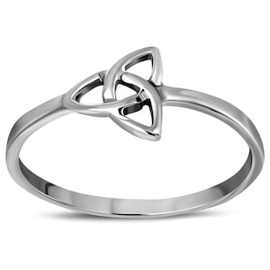May include: A silver ring with a Celtic knot design.