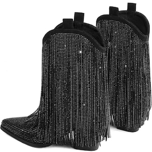 May include: A pair of black cowboy boots with pointed toes and a fringe of sparkling rhinestones. The boots have a short heel and a pull-on design, perfect for adding a touch of glamour to any outfit.