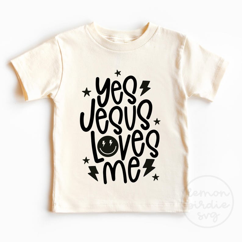 May include: A white t-shirt with black text that reads "yes jesus loves me" with a smiley face graphic.