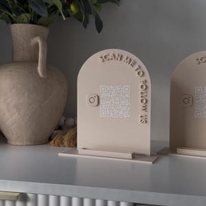 May include: A set of three ceramic mugs with a speckled, matte finish in cream, light grey, and dark grey. Each mug has a simple, minimalist design, suitable for coffee or tea.