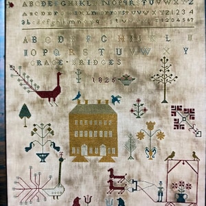 May include: A vintage needlepoint sampler featuring a house, birds, trees, and a peacock. The sampler is dated 1825 and includes the name "Grace Bridges".
