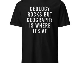 May include: Black t-shirt with white text that reads "Geology rocks but geography is where it's at".