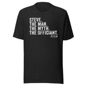 May include: Black t-shirt with white text that reads "STEVE. THE MAN. THE MYTH. THE OFFICIANT. 21.11.24"
