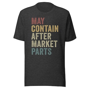 May include: A dark heather grey t-shirt with a vintage-style graphic that reads "MAY CONTAIN AFTER MARKET PARTS".