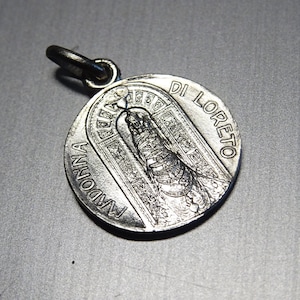 The Madonna of Loreto or Pilgrim&#39;s Madonna is a painting. reverse side, Traslazione Santa Casa. Pendant medallion Holy Charm BB 983