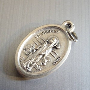 St Bridget the patron saint of Ireland. Saint Patrick is the Apostle of Ireland. Medal Catholic Pendant Medallion Holy Charm D 568