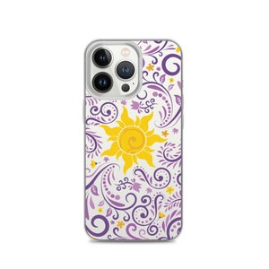 May include: A clear phone case with a white background and a purple and yellow floral design. The design features a sun with a yellow center and purple rays. The case is compatible with an iPhone 14 Pro.