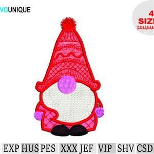 May include: Red and white gnome embroidery design in four sizes: 3.8, 5.0, 6.5, and 8.5 inches. The gnome is wearing a red hat with a white pom-pom and a white beard. The gnome is holding a pink scarf in its hands.