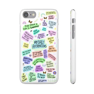 May include: White iPhone case with a colorful design featuring positive affirmations and motivational quotes. The design includes phrases like "I am loved", "The pain I feel is temporary", "My daily affirmations", and "I trust myself".