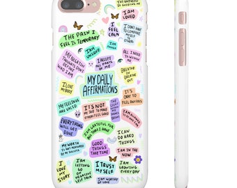 May include: White iPhone case with a colorful design featuring positive affirmations and motivational quotes. The text includes phrases like "The pain I feel is temporary", "I am unique", "My daily affirmations", "I am loved", "I am worthy of love", and "I can do hard things".