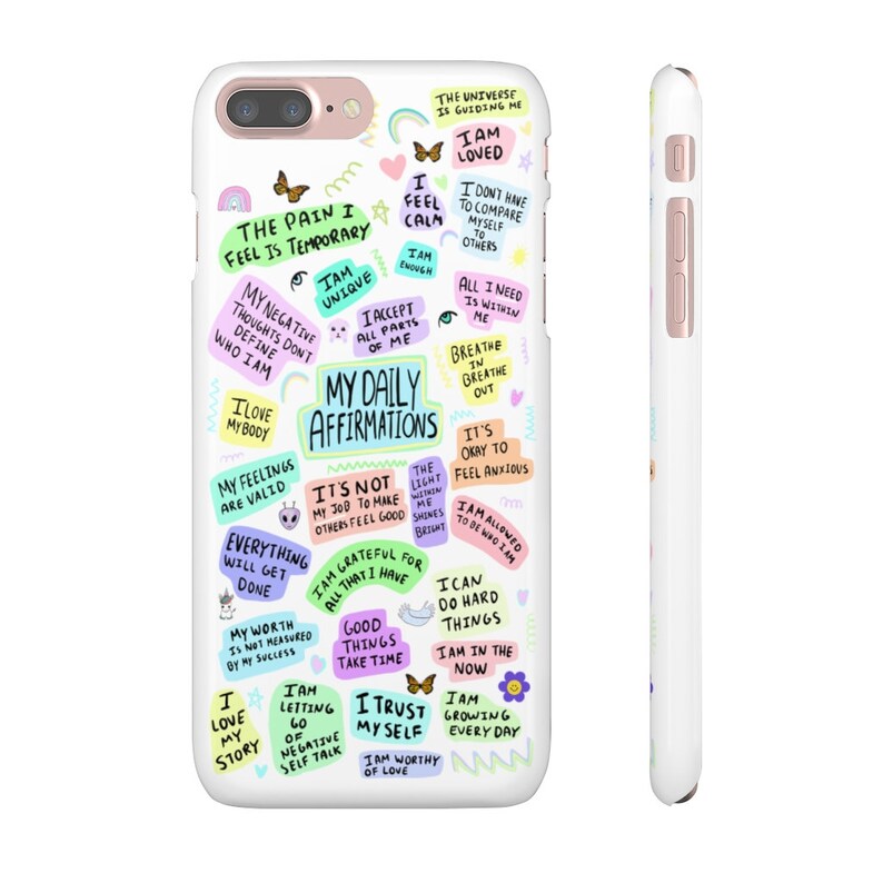 May include: White iPhone case with a colorful design featuring positive affirmations and motivational quotes. The text includes phrases like "The pain I feel is temporary", "I am unique", "My daily affirmations", "I am loved", "I am worthy of love", and "I can do hard things".