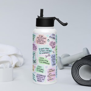 Stainless steel water bottle with a straw lid
