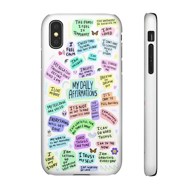 May include: A white phone case with a colorful design featuring positive affirmations and inspirational quotes. The text includes phrases like "I am loved", "My daily affirmations", "I am unique", "I love my body", "Everything will get done", "I trust myself", and "I am worthy of love".