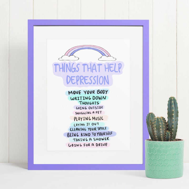 Może przedstawiać: Wydruk w ramie z tęczą i tekstem "Things that help depression" po kt&oacute;rym następuje lista czynności, w tym "Move your body", "Writing down thoughts", "Going outside", "Snuggling a pet", "Playing music", "Crying it out", "Cleaning your space", "Being kind to yourself", "Taking a shower" i "Going for a drive".