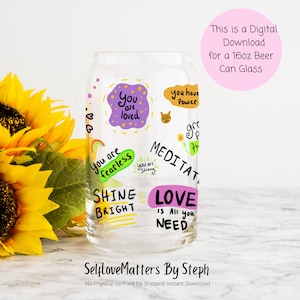 May include: A clear glass 16oz beer can with colorful hand-painted designs and positive affirmations, including "You are loved", "You are fearless", "Shine Bright", "Love is all you need", and "Meditate".