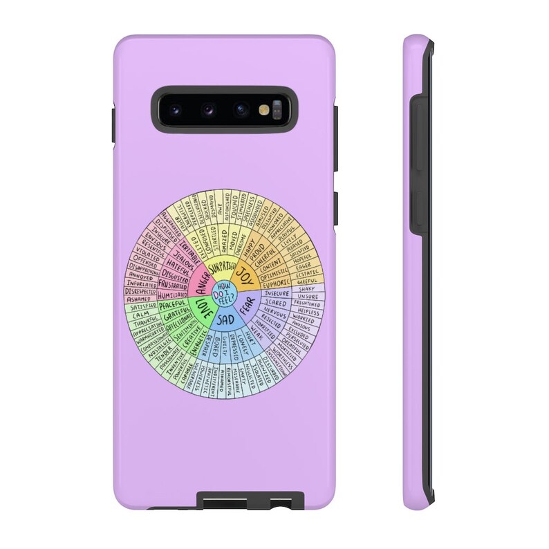 May include: A lavender phone case featuring a colorful wheel diagram with words like "joy," "sad," and "fear." The diagram is a visual representation of emotions. The case has a black border and a camera cutout.