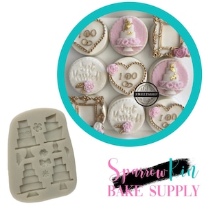 May include: A silicone mold with cake and decorative shapes, and a collection of decorated cookies. The cookies feature gold accents, pink flowers, and the words "Just Married" and "I Do". The cookies are arranged in a teal circle.