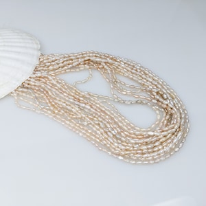 Cream Chinese freshwater rice Krispies  3.0-3.5 by 8mm pearl strand