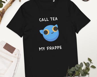 May include: Black t-shirt with the text "CALL TEA MY FRAPPE" and a blue cartoon character with large yellow eyes. The shirt is made of a soft material and has a crew neck.